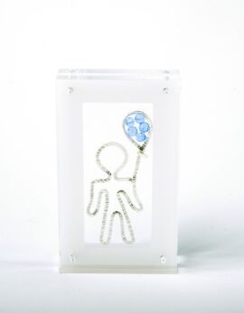 Handmade sterling silver lucky boy charm in plexiglass.